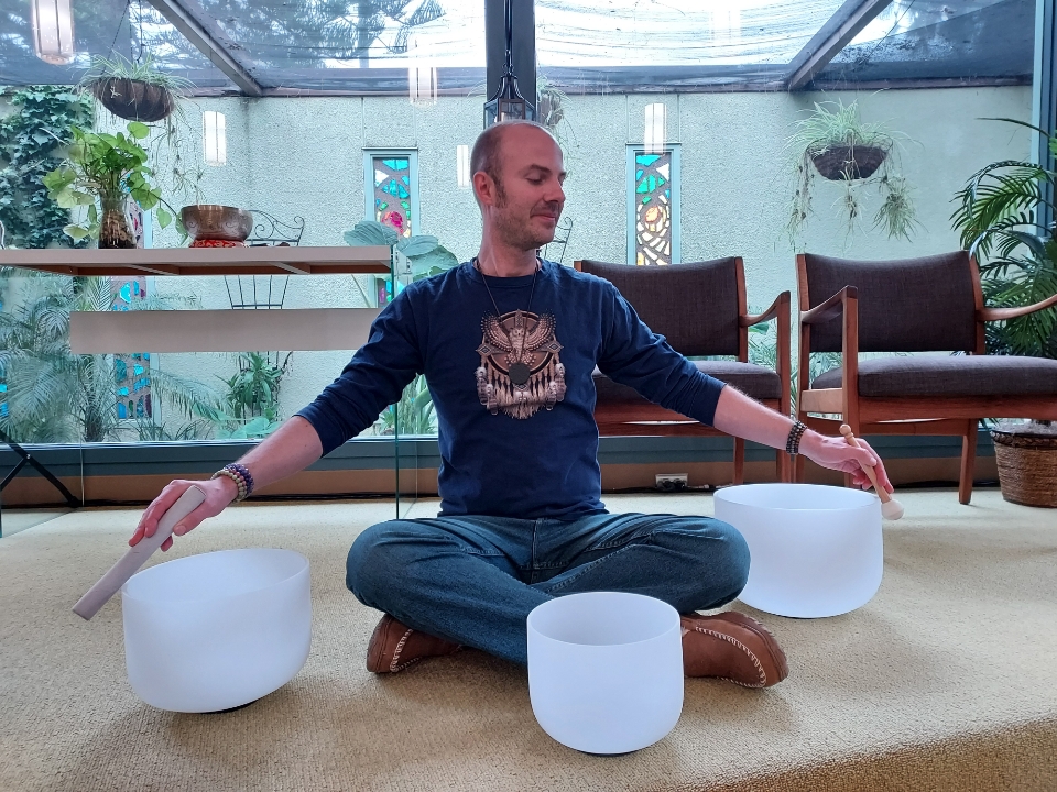 Image shows Johnny Sage in the sanctuary, leading a meditation.