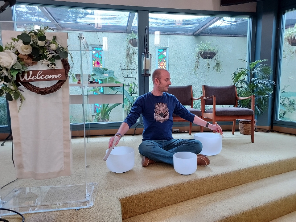 Image shows Johnny Sage in the sanctuary, leading a meditation.