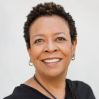 Image is a headshot of Phyllis Douglass smiling